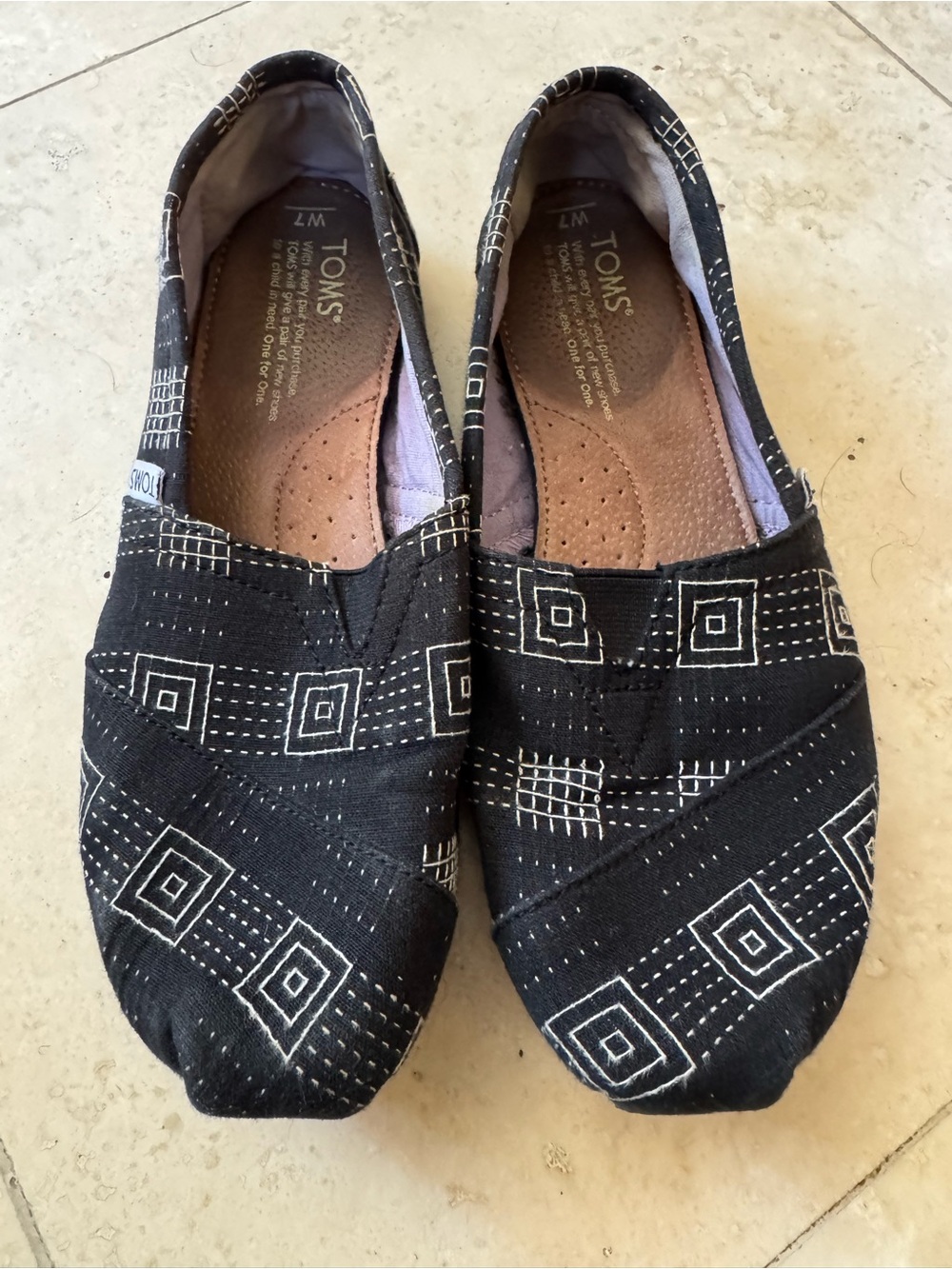 Toms Black Canvas Slip-On Shoes with White Geometric Pattern